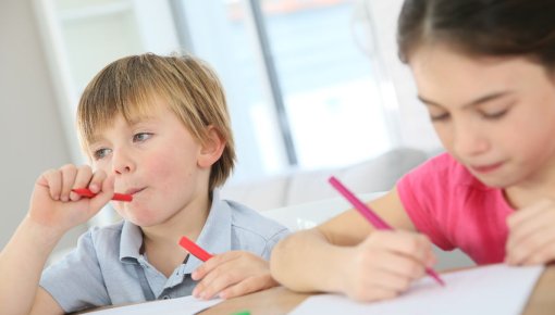 Photo of a boy daydreaming in class