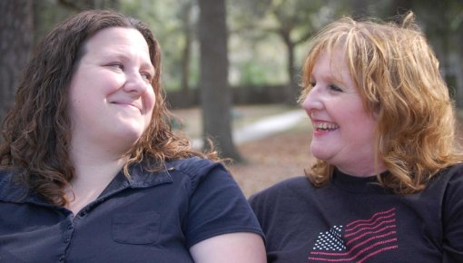 Photo of two women smiling at each other