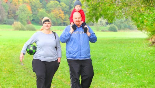 Photo of an overweight family on a walk