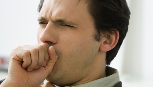 Photo of a man coughing