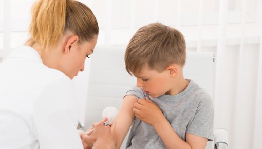 Photo of a boy having an injection