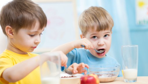 Photo of two boys having breakfast