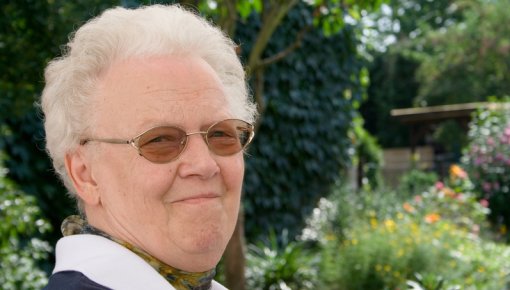 Photo of an elderly woman in the garden