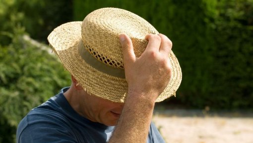 Photo of a man wearing a straw hat