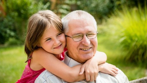 Photo of a grandfather with his granddaughter