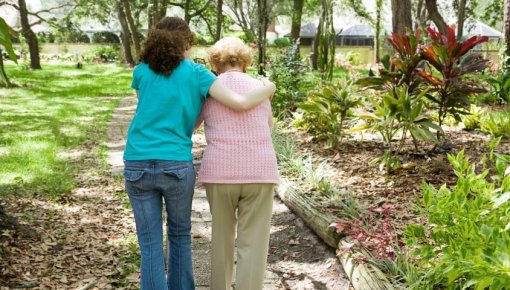 photo of daughter and elderly mother on a walk