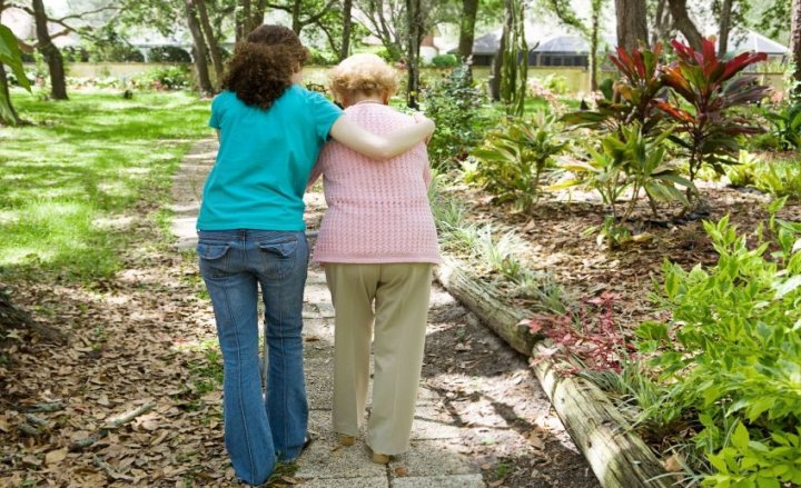 Photo of two people walking together outdoors