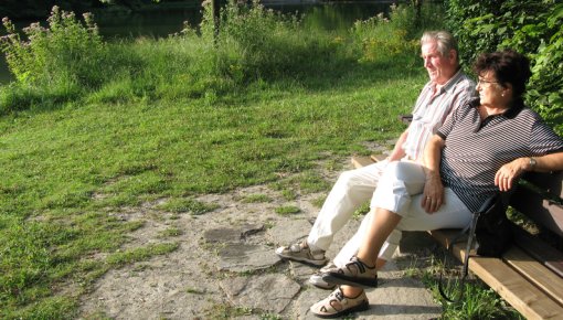 Photo of a couple sitting outdoors