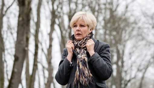 Photo of woman wearing a scarf outdoors