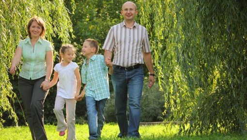 Photo of a family taking a stroll