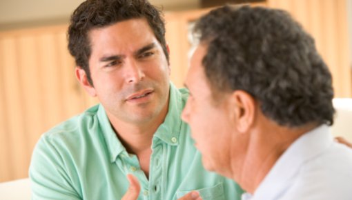 Photo of two men chatting