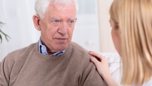 Photo of a man and a woman talking