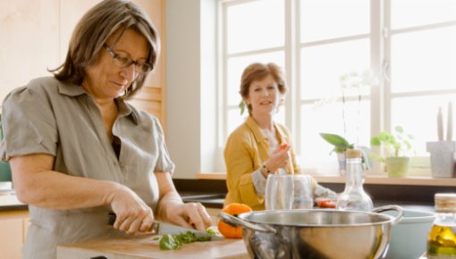 Photo of two women cooking