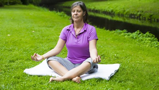 Photo of a woman doing yoga in a park
