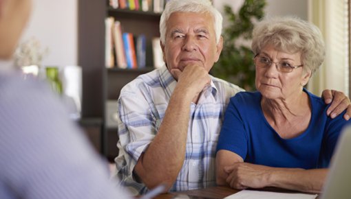 Photo of couple talking to doctor