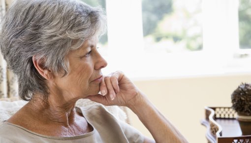 Photo of a woman resting her chin on her hand