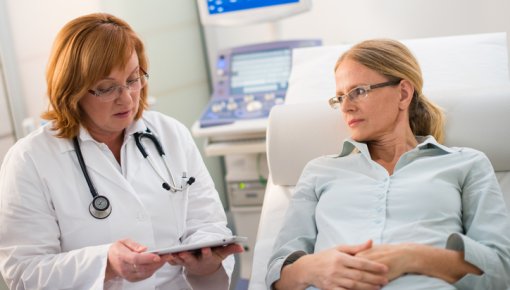 Photo of gynecologist with patient