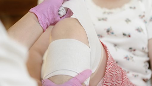 Photo of a nurse treating a wound