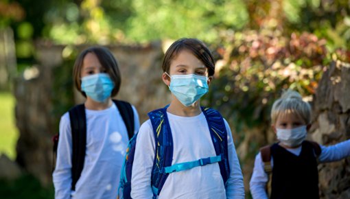 Group of children wearing face masks outdoors