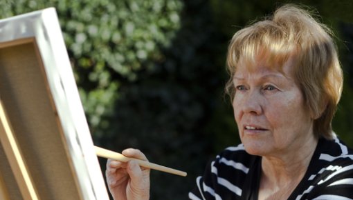 Photo of a woman painting