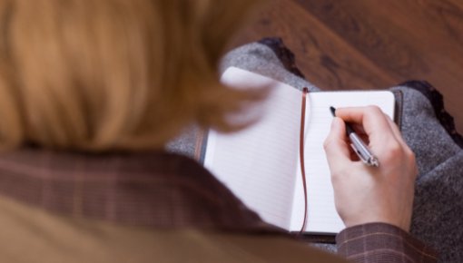 Photo of a woman with a diary