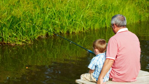 Photo of a man and boy fishing