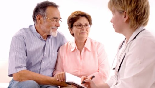 Photo of an older couple and a doctor