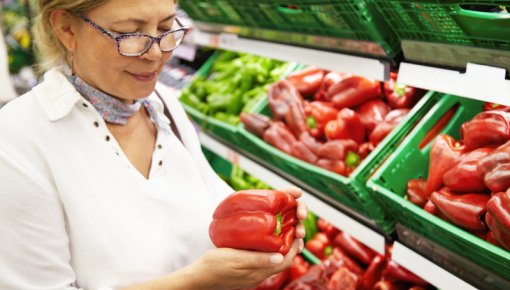 Photo of a woman buying vegetables