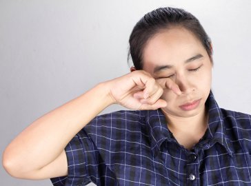 Photo of an exhausted woman with pale skin