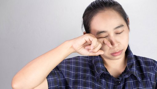 Photo of an exhausted woman with pale skin