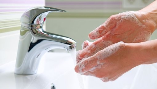 A person washing their hands