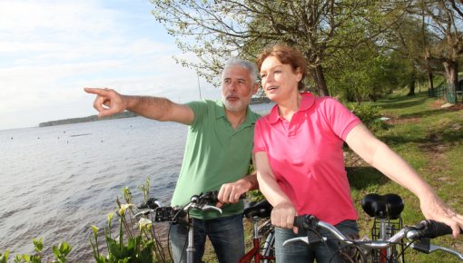 Photo of a couple on a bike ride