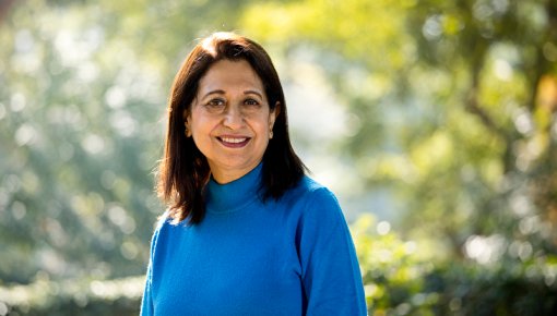 Woman with blue sweater in a park
