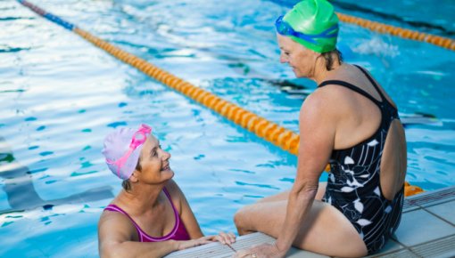 Photo of two women at a swimming pool