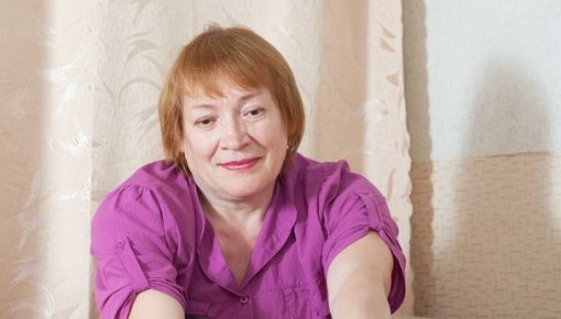 Photo of a woman looking at her toenails