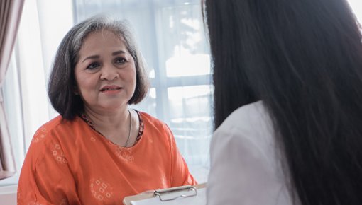 Photo of a patient talking with her doctor