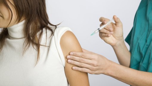 Photo of a woman being vaccinated