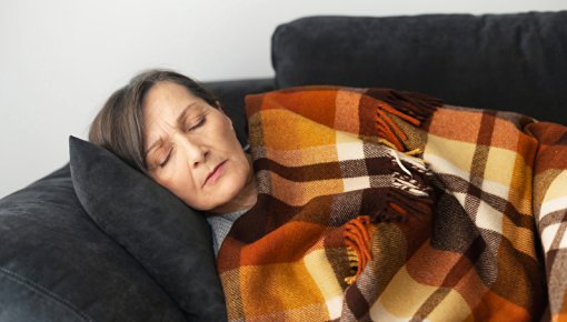 Photo of a woman relaxing on a sofa 