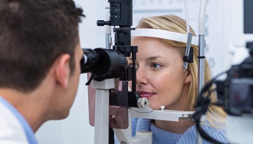 Photo of a woman having her eyes examined