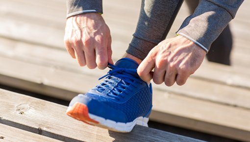 Photo of a person tying their shoelaces