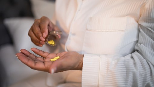 Photo of woman taking medication