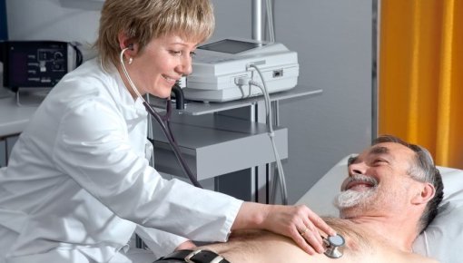 Photo of patient being examined by a doctor