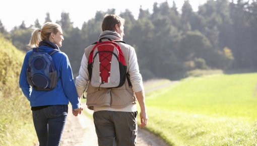 Photo of couple hiking on a sunny day
