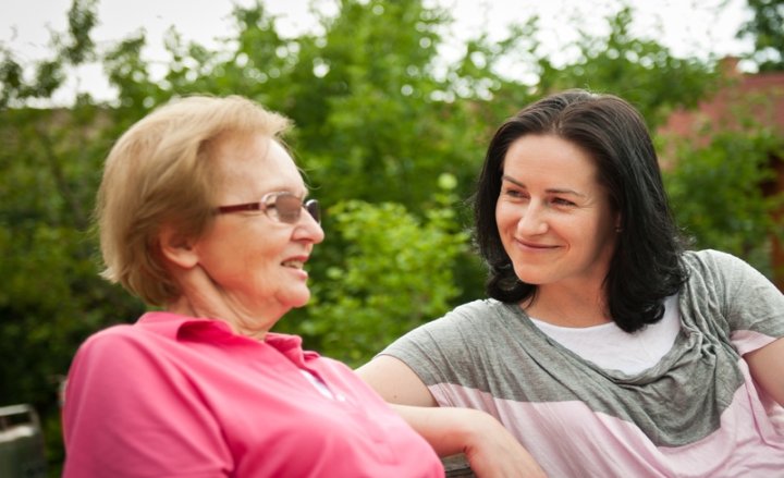 Photo of two women talking