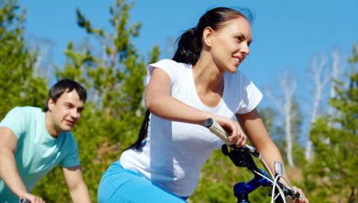 Photo of a couple riding bikes