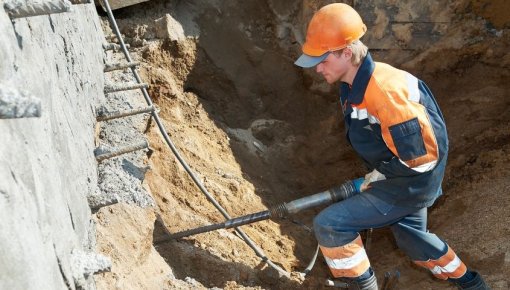 Photo of a worker using a jackhammer