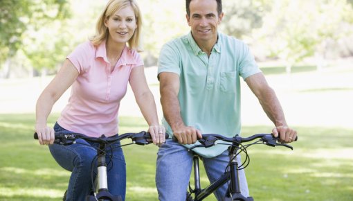 Photo of a couple on bikes