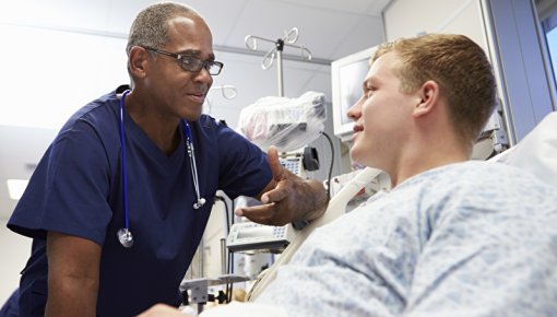 Photo of a teenager and doctor in the hospital