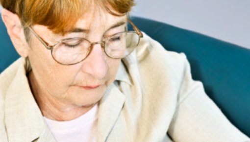 Photo of a woman taking a tablet