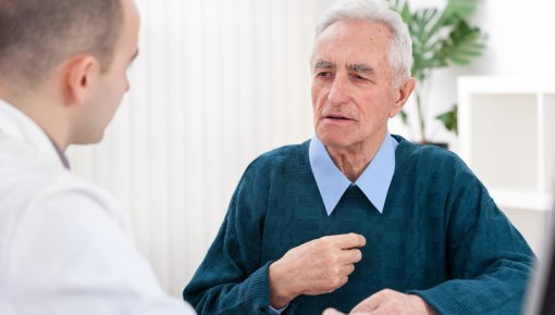 Photo of a man talking to a doctor